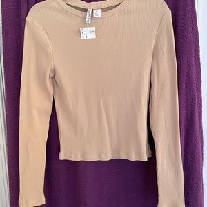Divided beige long sleeved shirt size Medium